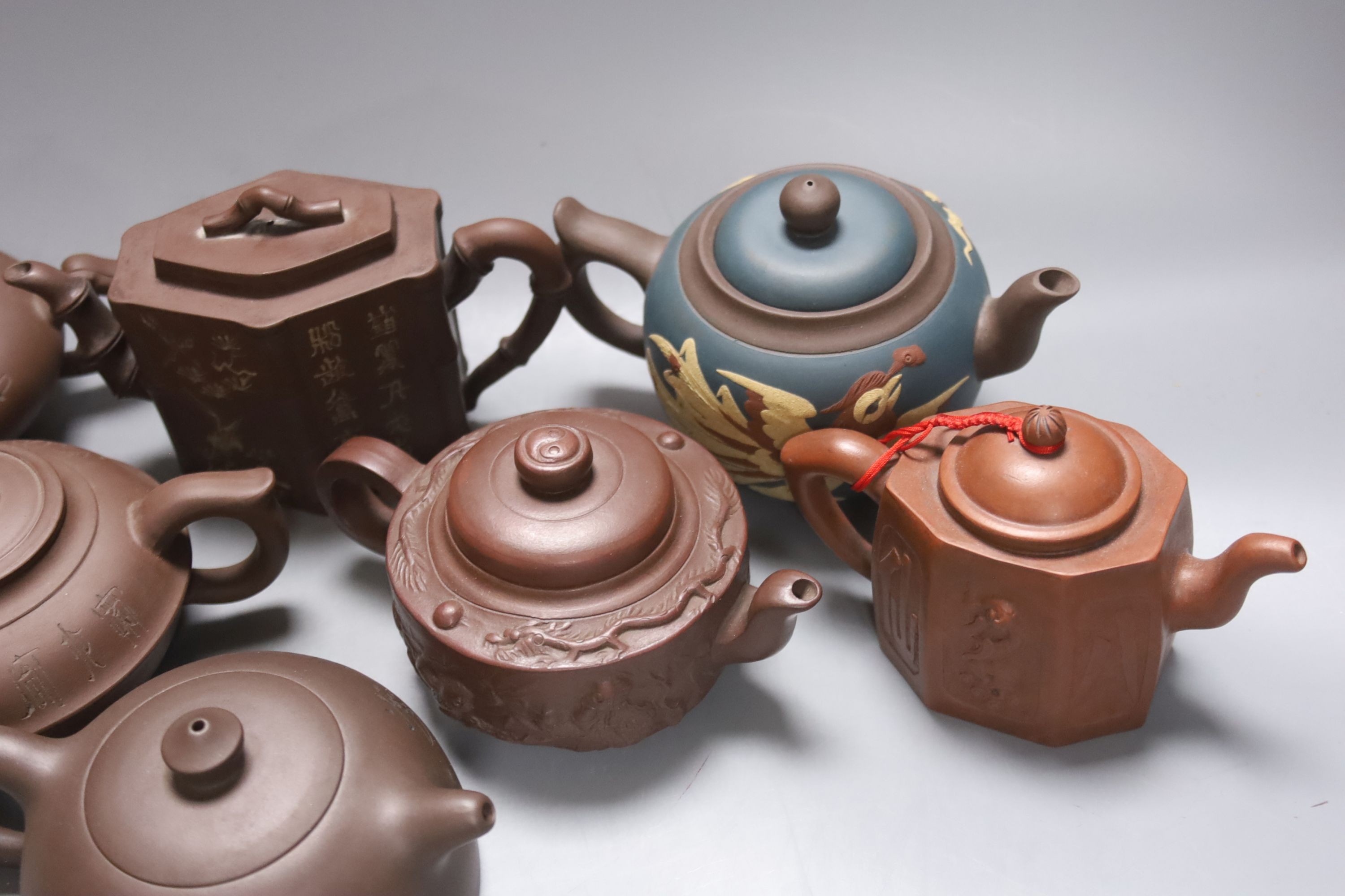 Seven Chinese Yixing teapots, tallest 11 cms high.